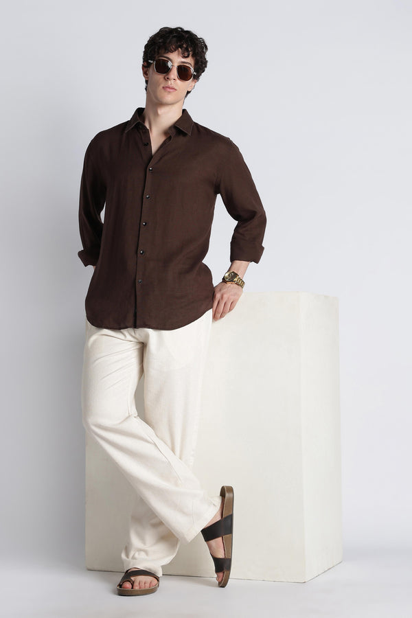 IVYN ecru linen-blend trousers styled in a premium editorial look