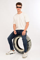 Seated styled look featuring IVYN Arden Deep Indigo Wash ankle-fit jeans