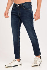 Three-quarter view of IVYN Arden Deep Indigo Wash tapered jeans