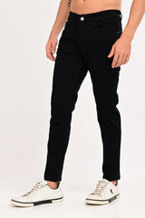 Angled front view of IVYN Arden Jet Black ankle-fit jeans