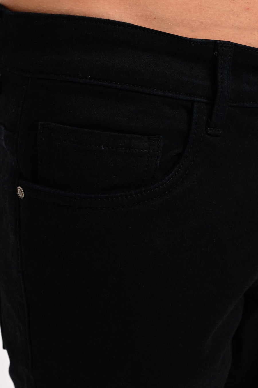 Coin pocket, branded rivet and tonal stitching on IVYN Jet Black jeans