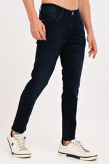 Angled front view of IVYN Arden Midnight Indigo Wash ankle-fit jeans