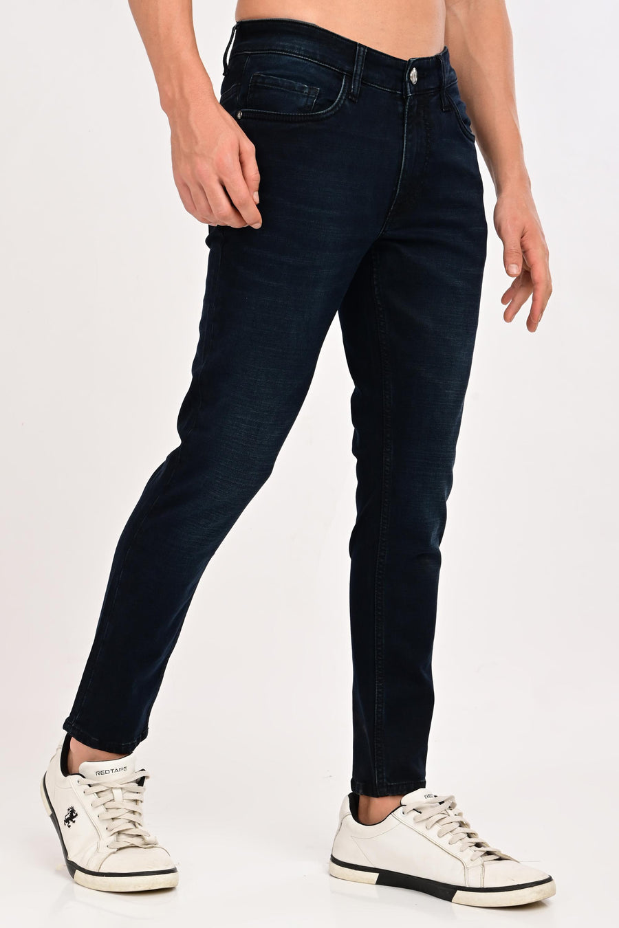 Angled front view of IVYN Arden Midnight Indigo Wash ankle-fit jeans