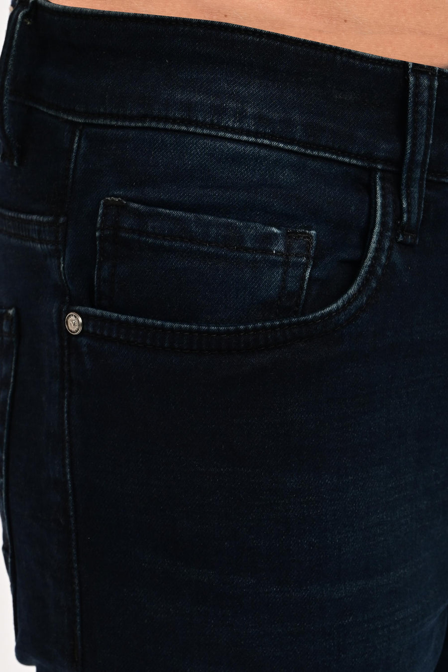 Coin pocket, branded rivet and tonal stitching on IVYN Midnight Indigo Wash jeans