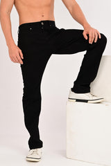 Raised-leg view showing the fit and movement of IVYN Camden Jet Black jeans