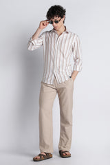 IVYN mushroom taupe trousers styled with a striped shirt
