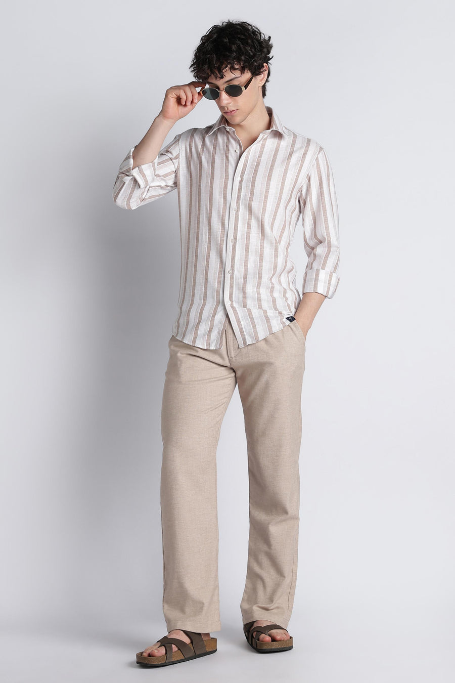 IVYN mushroom taupe trousers styled with a striped shirt