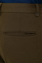 Rear welt pocket and IVYN metal detail on Deep Olive formal trousers