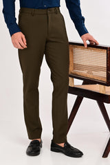 Editorial look featuring IVYN Regent Deep Olive tailored trousers