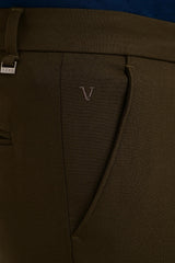 Angled pocket, tonal embroidery and IVYN metal detail on Deep Olive trousers