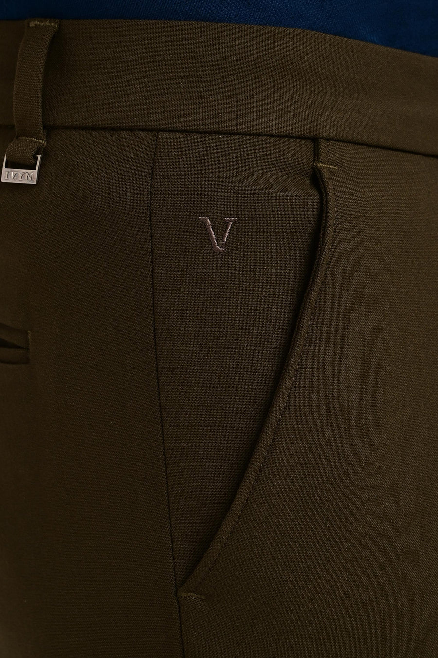 Angled pocket, tonal embroidery and IVYN metal detail on Deep Olive trousers