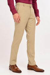 Model wearing IVYN Regent Desert Sand melange formal trousers with a burgundy shirt