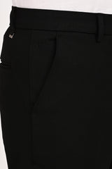 Angled pocket, tonal embroidery and IVYN metal detail on Jet Black trousers