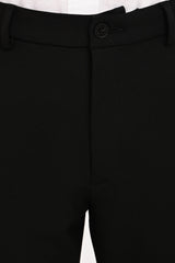 Waistband, button and concealed fly detail of IVYN Jet Black trousers