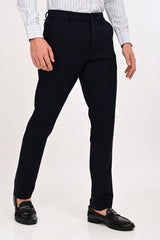 Angled front view of IVYN Regent Midnight Navy formal trousers