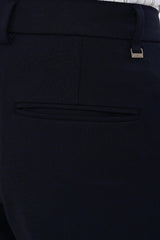 Rear welt pocket and IVYN metal detail on Midnight Navy formal trousers