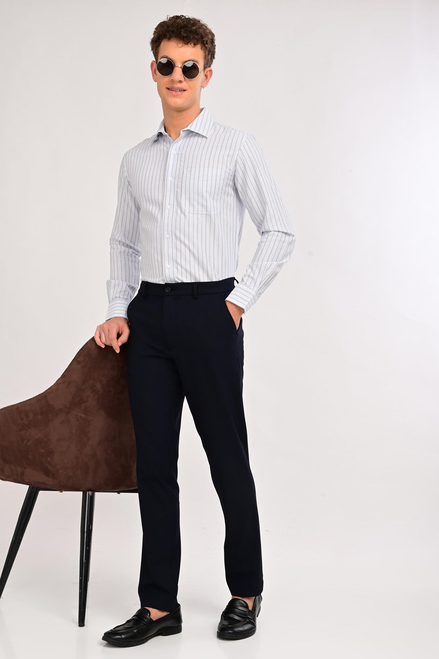 Model wearing IVYN Regent Midnight Navy slim-fit formal trousers