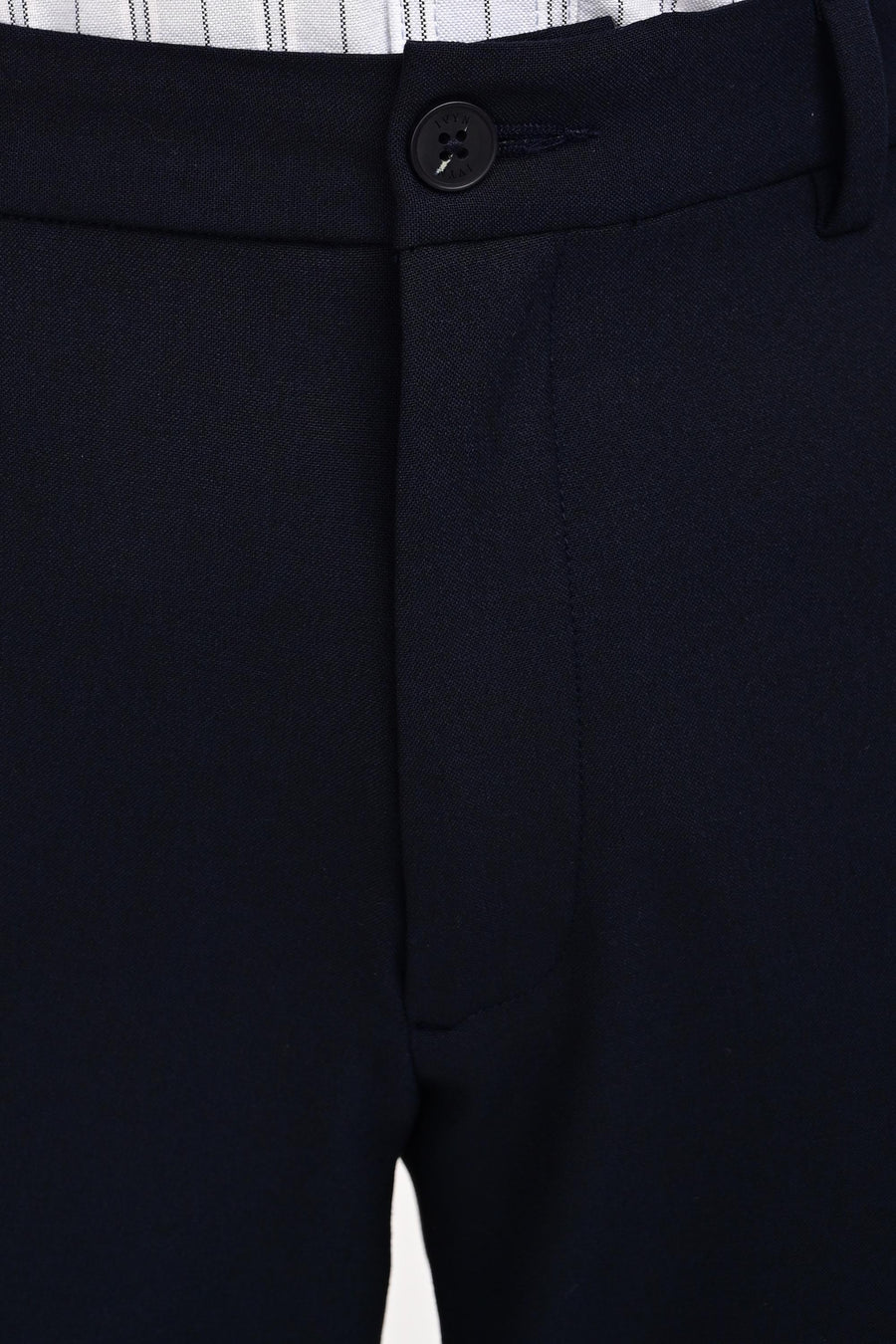 Waistband, button and concealed fly detail of IVYN Midnight Navy trousers