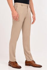 Three-quarter view of IVYN Regent mink beige slim-fit formal trousers