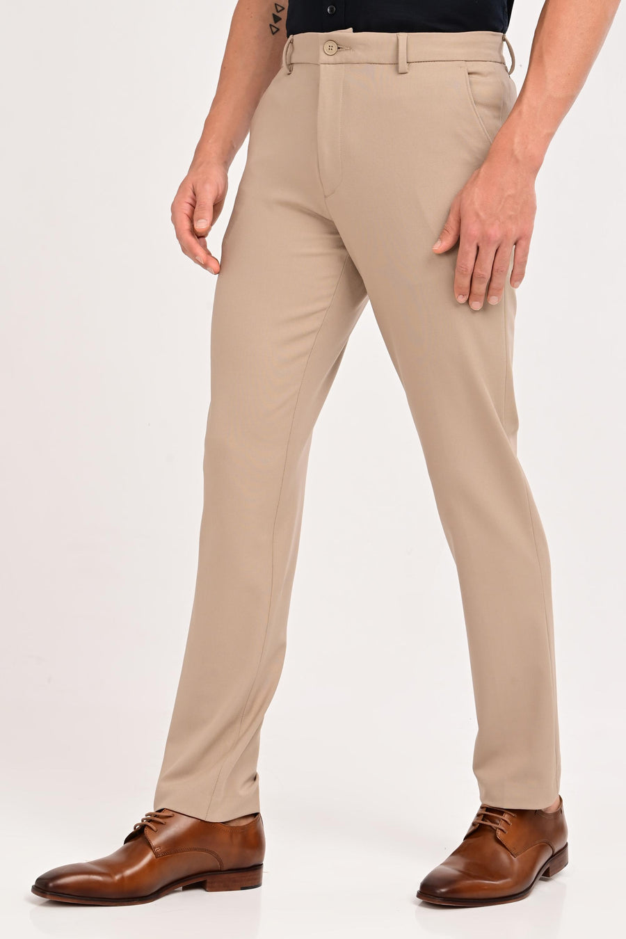 Angled front view of IVYN Regent mink beige tailored trousers