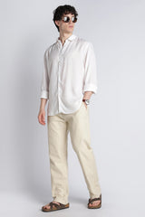 Relaxed full-length look featuring IVYN soft cream straight-fit trousers